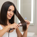 Using straightening brush on hair