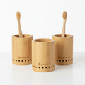 Bamboo toothbrush holders on bathroom counter