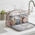 Waterproof floral toiletry bag open on bathroom counter