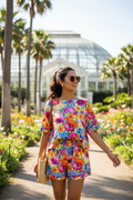 Woman wearing Floral Paradise short set in botanical garden